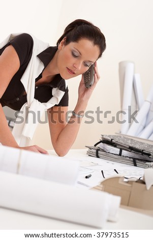 Female architect with telephone at the office