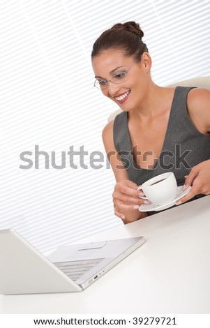 Corporate manager working with laptop at the office