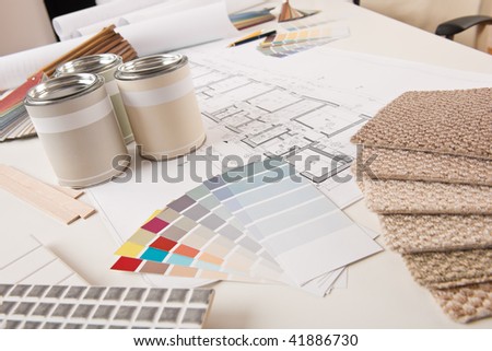 Office of interior designer with paint and color swatch on the desk