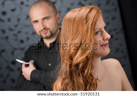 stock photo : Professional hairdresser with long red curly hair fashion 