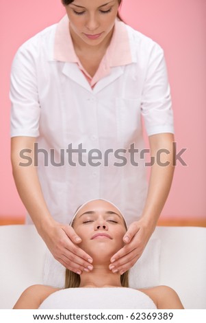 Woman receive luxury facial massage at day spa