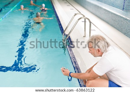 Swimming pool - swimmer training competition in class with coach