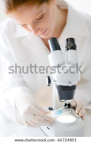 Microscope laboratory - woman medical research chemist experiment, shallow depth-of-field