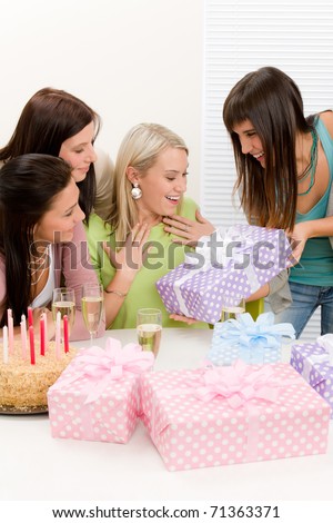 Birthday party - woman getting present with champagne and cake