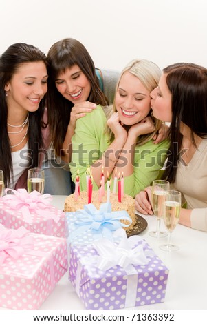 Birthday party - group of woman celebrate with cake and champagne