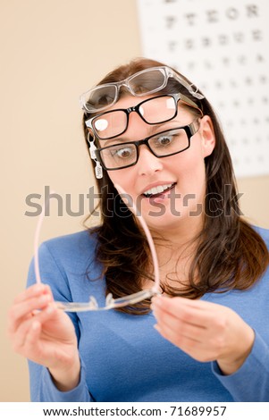 Portrait of optician client choose prescription glasses