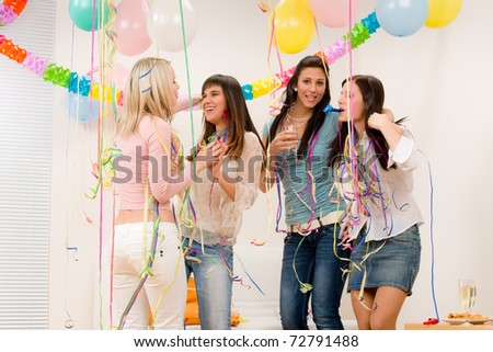 Birthday party celebration - four woman with confetti have fun, toast, dance
