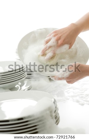 Washing dishes - hands with gloves in kitchen, housework