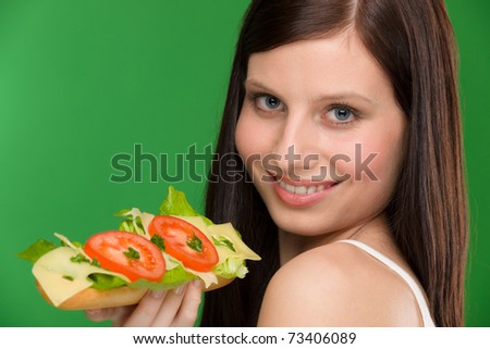 Healthy lifestyle - woman enjoy cheese tomato sandwich