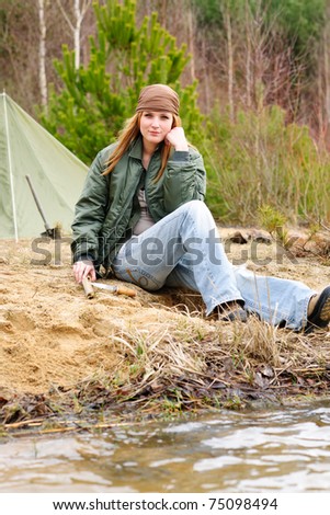 Camping happy woman tent nature sitting by stream