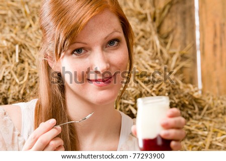 Young romantic woman enjoy natural home-made yogurt in barn