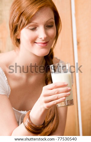 Young woman drink healthy natural home-made milk country