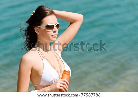 Summer sun young woman with suncream wear bikini enjoy