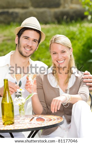 Italian restaurant terrace, an elegant couple celebrate