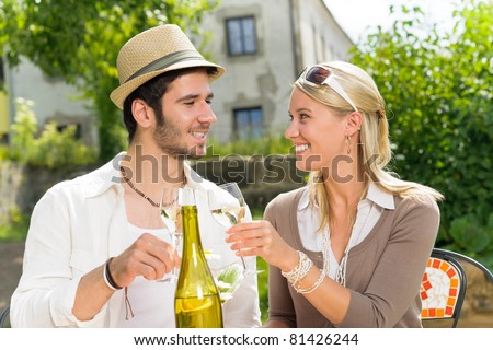 Italian restaurant terrace elegant couple celebrate drink wine summer day