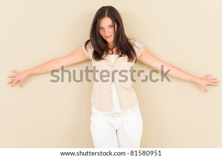 Casual business woman attractive provocative pose leaning against wall