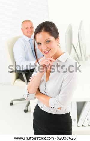 Professional businesswoman attractive smiling portrait in office