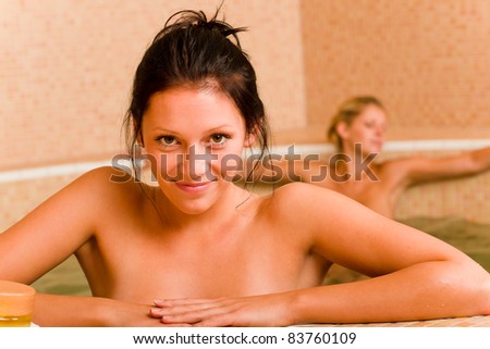stock photo Relax spa pool two naked women inside water beauty health