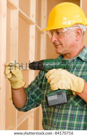 Handyman working on wall renovations