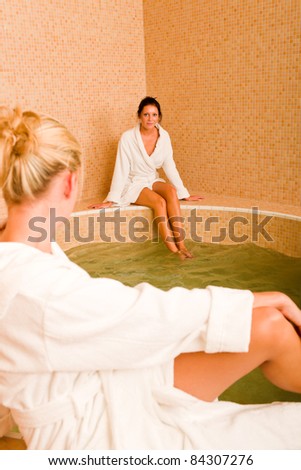 Relax bath healthy spa two beauty woman sitting bathrobe pool