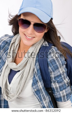 Smiling female teenager girl wear cool outfit and sunglasses