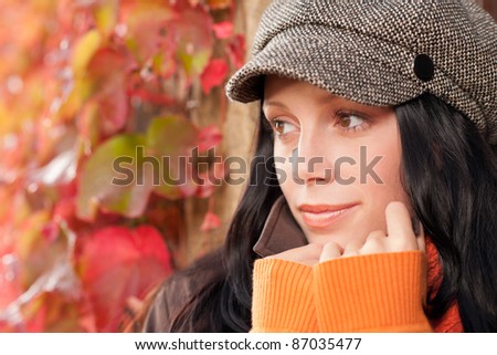 Autumn leaves portrait of beautiful female model posing fashion outfit