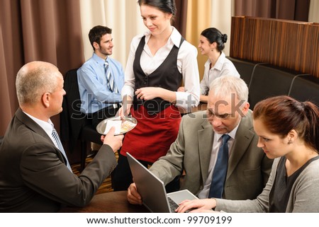 Executive business man pay restaurant bill during management meeting