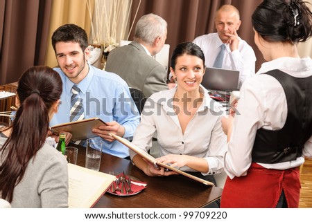Business lunch executive people looking menu  waitress taking order restaurant
