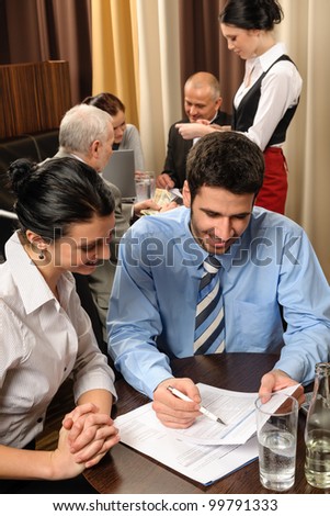 Business people discuss reports management meeting at restaurant conference room