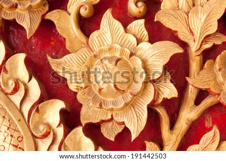 Art of wood carving. Cotton rose in line thai art.  A beautiful Asian sculptures.