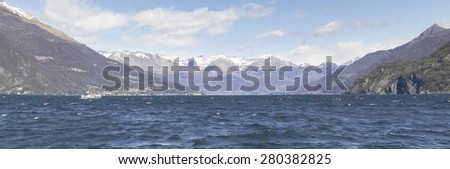 Lake of Como, Italy: Picture of the lake to the north with snow-capped mountains. The wind makes the evocative image.