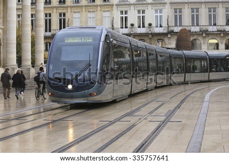 BORDEAUX, FRANCE- November 5, 2015:  Tram is passing by (Grand theatre) Grand Theatre de Bordeaux in France.