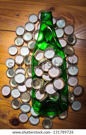 strained bottle among metal lids