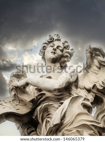 Bernini\'s marble statue of angel with cross from the Sant\'Angelo Bridge in Rome, Italy