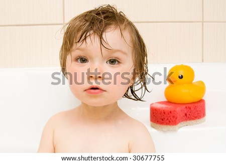 sweet toddler baby girl in bath