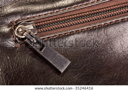 zip on brown leather bag