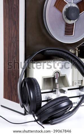 tape recorder with headphones on white background