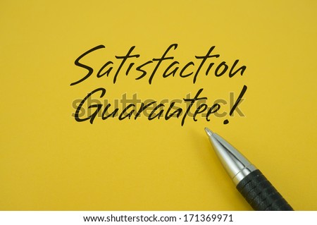 Satisfaction Guarantee! note with pen on yellow background