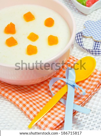 Baby milk porridge..Kid food with fruits.Sweet semolina.
