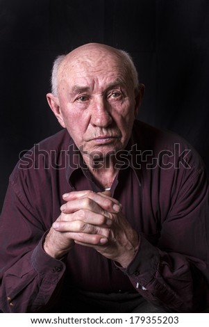 Studio portrait of an old man