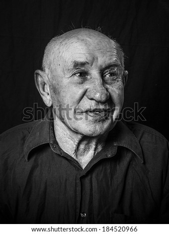 Studio portrait of laughing old man