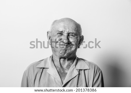 Portrait of an old man with a toothache