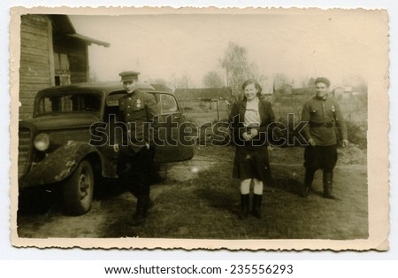 Ussr - CIRCA 1940s: An antique Black & White photo show soldiers near the machine