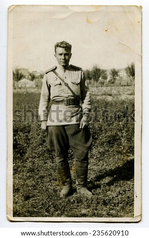 USSR - CIRCA 1960s: An antique photo shows studio portrait of a Red Army soldier.