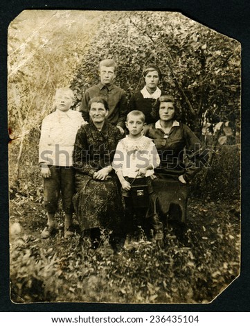 Ussr - CIRCA 1940s: An antique Black & White photo show family in the garden