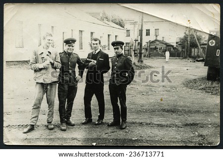 Ussr - CIRCA 1970s: An antique Black & White photo show four men
