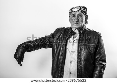 Portrait of an old man pointing his finger down biker