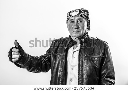 old man showing thumbs up