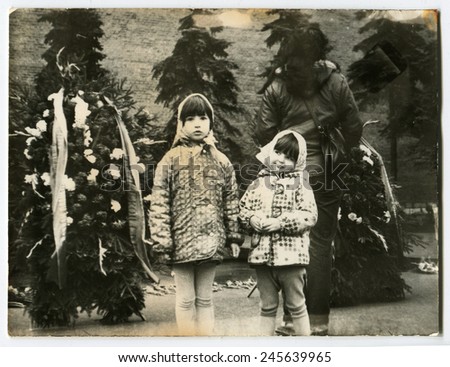 Ussr - CIRCA 1980s: An antique Black & White photo show two girls near Christmas trees