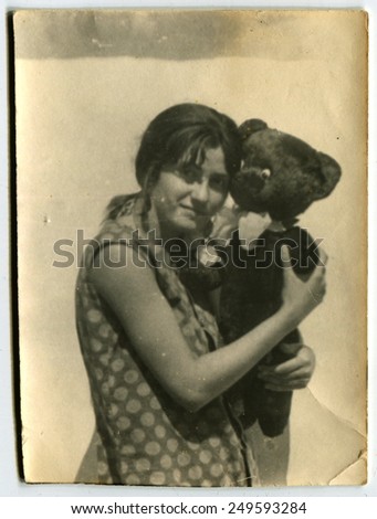 Ussr - CIRCA 1970s: An antique Black & White photo show girl with teddy bear